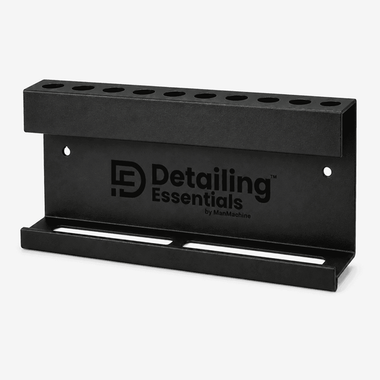 Wall-mounted detailing tool holder from Detailing Essentials, with brush and bottle storage for car detailing organization.